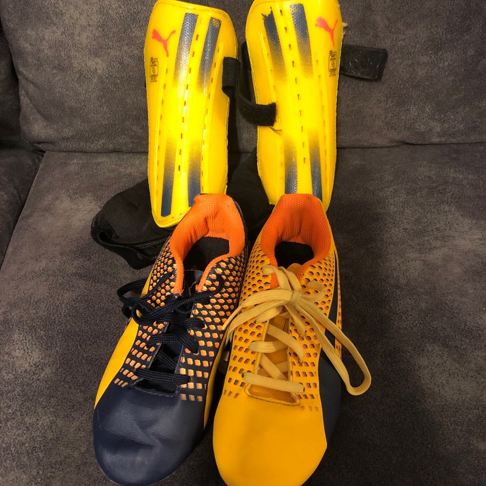 Puma soccer cleats and shin guards